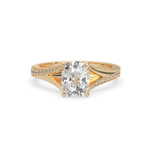 yellow Gold ring with a large diamond and smaller diamonds on the band against a white background