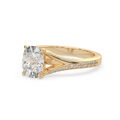 yellow Gold ring with a large diamond and smaller diamonds on the band against a white background