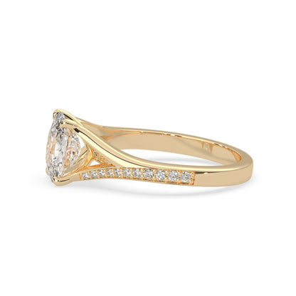 yellow Gold ring with a large diamond and smaller diamonds on the band against a white background