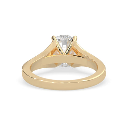 yellow Gold ring with a diamond on a white background