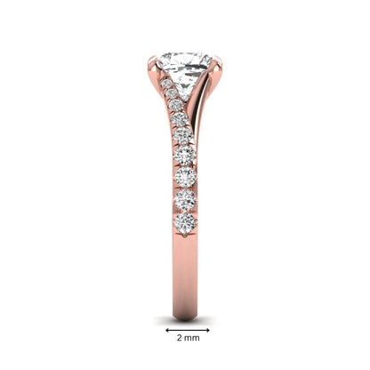 Cushion cut lab grown diamond split shank pavé engagement ring with four-prong setting and rose gold band.