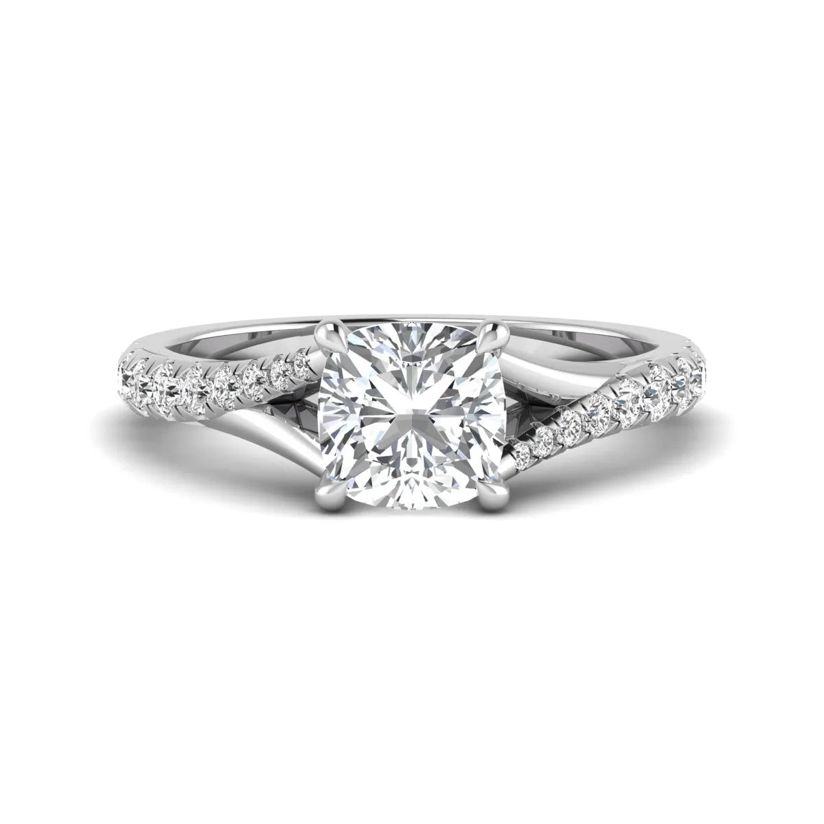 Cushion cut lab grown diamond split shank pavé engagement ring with four-prong setting and white gold band.