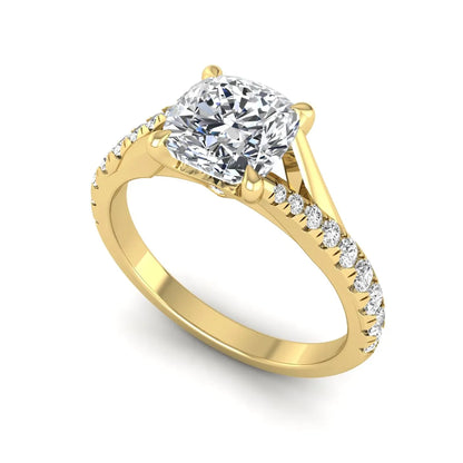 Cushion cut lab grown diamond split shank pavé engagement ring with four-prong setting and yellow gold band.