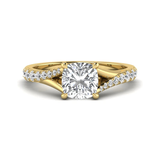 Cushion cut lab grown diamond split shank pavé engagement ring with four-prong setting and yellow gold band.