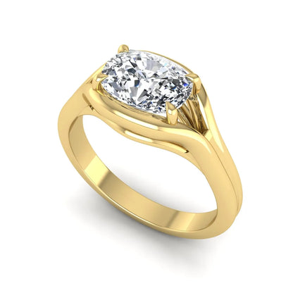 IGI certified cushion cut lab grown diamond split shank solitaire engagement ring in yellow gold.