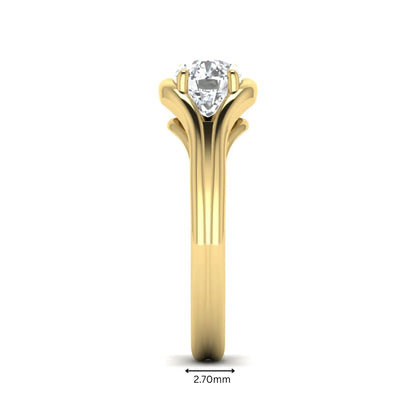 IGI certified cushion cut lab grown diamond split shank solitaire engagement ring in yellow gold.