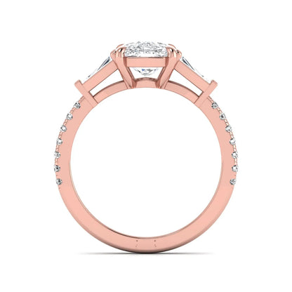 Cushion cut three stone lab grown diamond engagement ring featuring a 3.06 carat IGI certified cushion cut center diamond with tapered baguette side diamonds and pavé shank in rose gold.