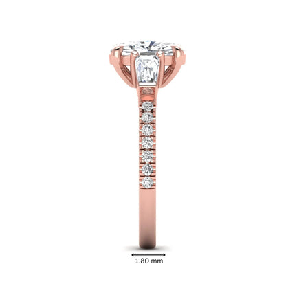 Cushion cut three stone lab grown diamond engagement ring featuring a 3.06 carat IGI certified cushion cut center diamond with tapered baguette side diamonds and pavé shank in rose gold.