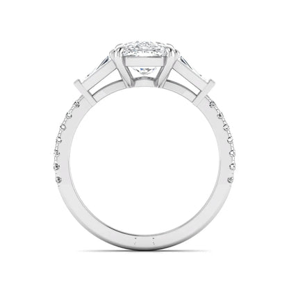 Cushion cut three stone lab grown diamond engagement ring featuring a 3.06 carat IGI certified cushion cut center diamond with tapered baguette side diamonds and pavé shank in white gold.