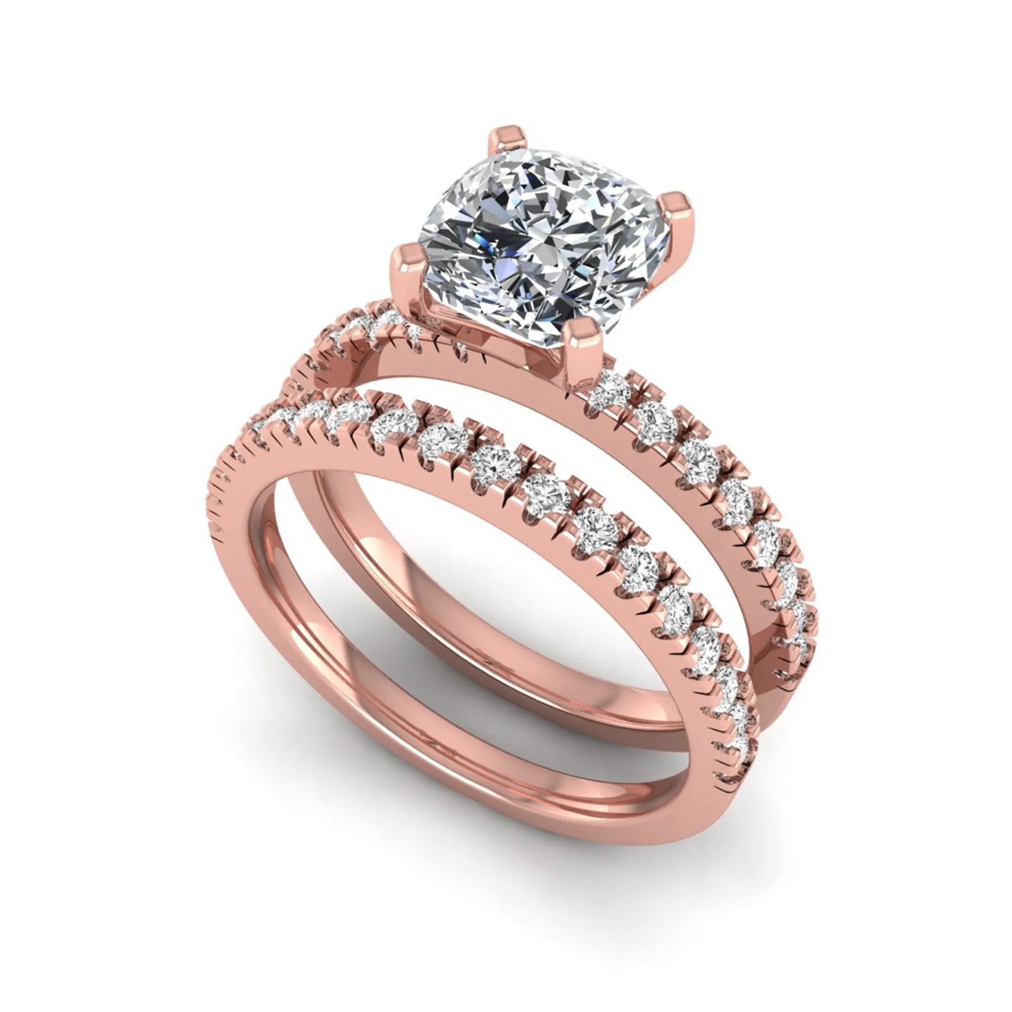Cushion cut lab grown diamond bridal ring set featuring a four-prong solitaire engagement ring with a matching pavé diamond wedding band in a rose gold tone design.