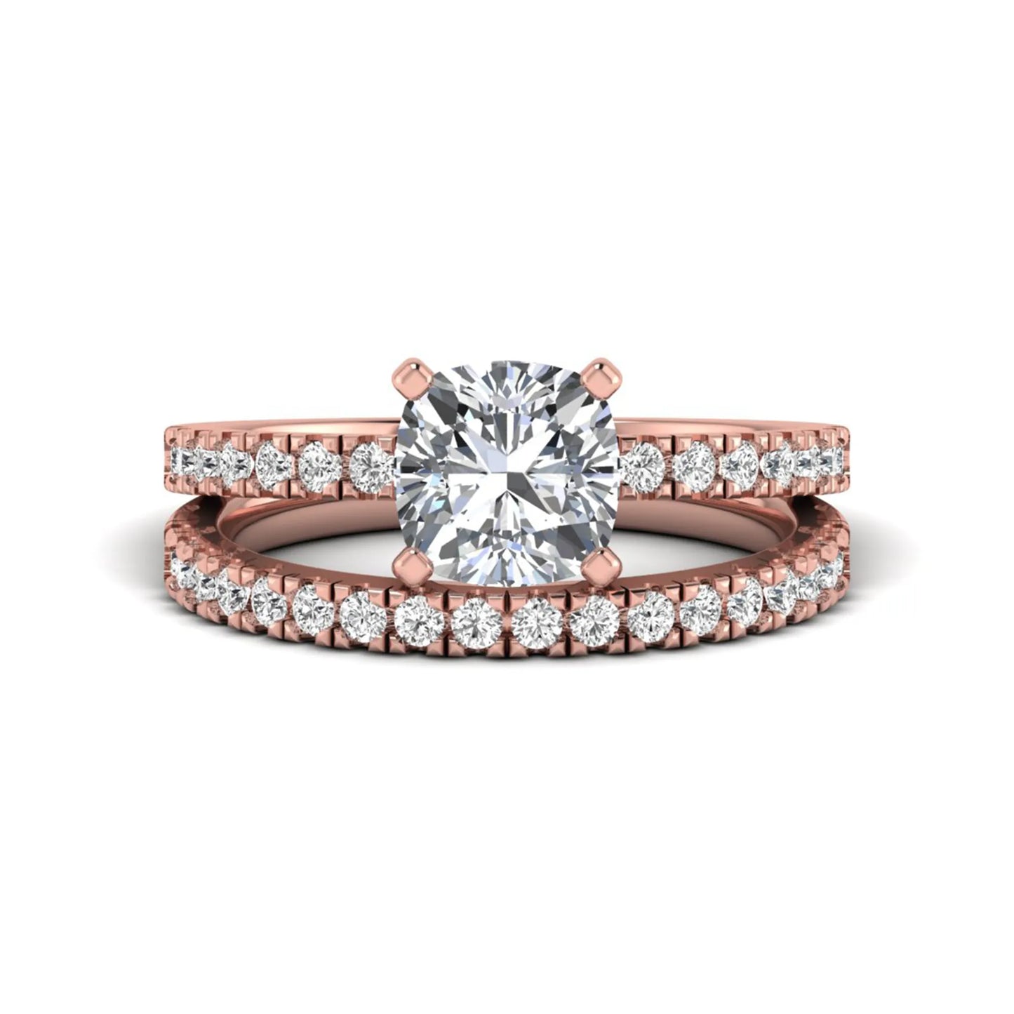 Cushion cut lab grown diamond bridal ring set featuring a four-prong solitaire engagement ring with a matching pavé diamond wedding band in a rose gold tone design.
