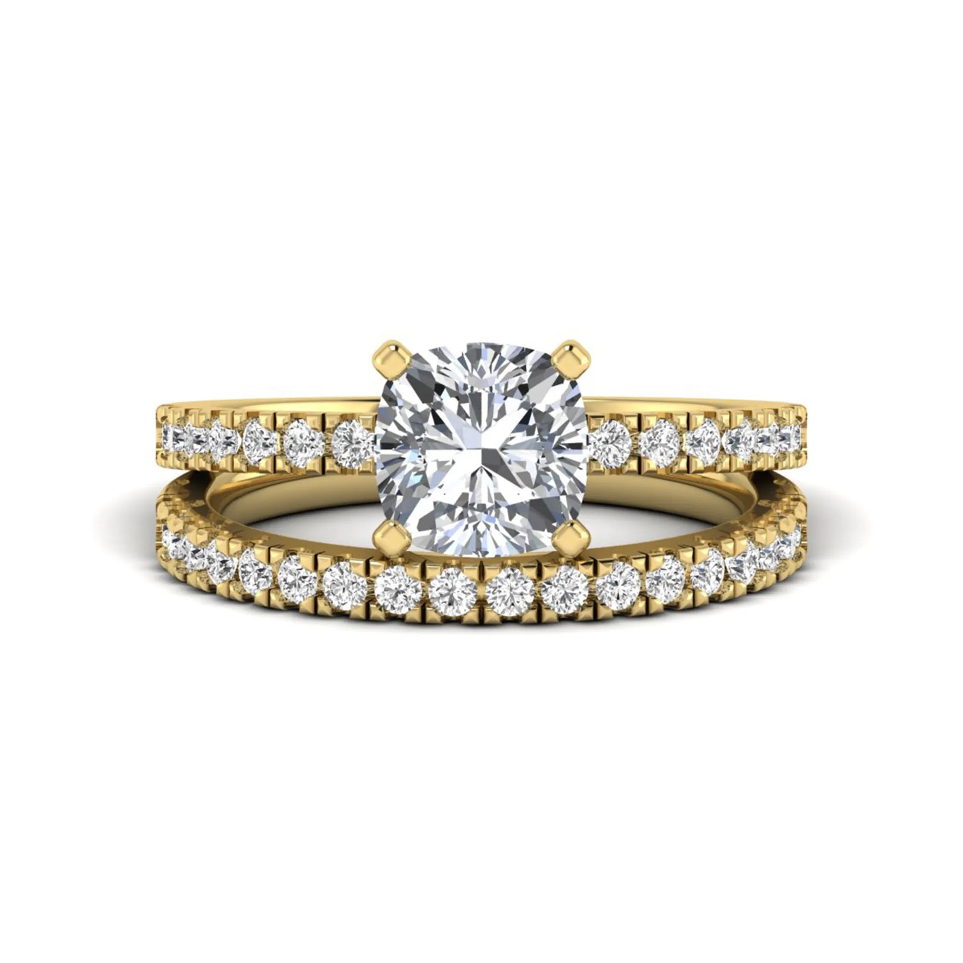 Cushion cut lab grown diamond bridal ring set featuring a four-prong solitaire engagement ring with a matching pavé diamond wedding band in a yellow gold tone design.