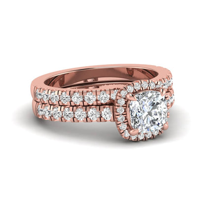 Cushion Halo Bridal Ring Set featuring a 6.00 mm cushion-cut lab grown diamond with a cushion halo, pavé cathedral engagement ring, and matching pavé wedding band in rose gold