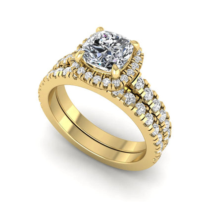 Cushion Halo Bridal Ring Set featuring a 6.00 mm cushion-cut lab grown diamond with a cushion halo, pavé cathedral engagement ring, and matching pavé wedding band in yellow gold