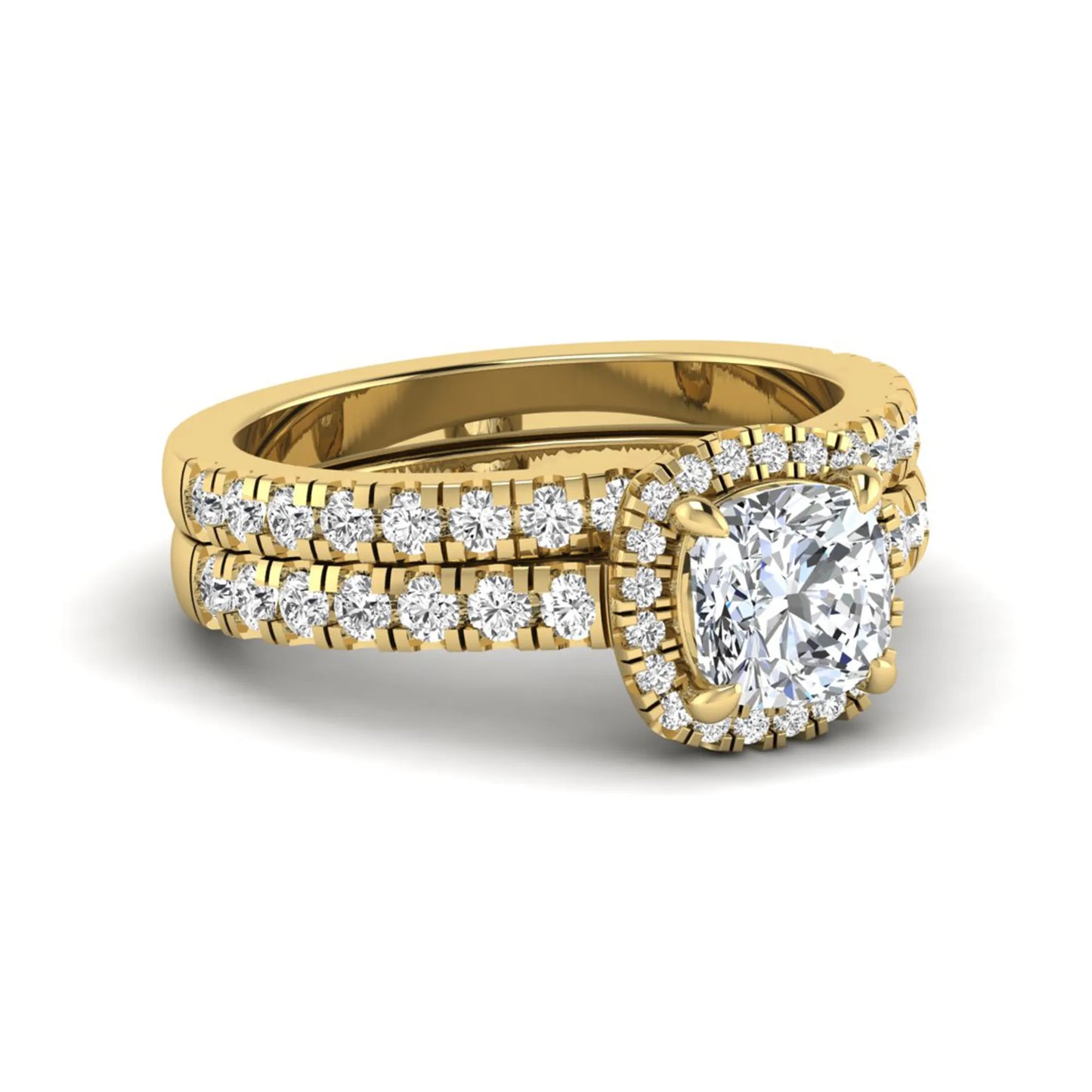 Cushion Halo Bridal Ring Set featuring a 6.00 mm cushion-cut lab grown diamond with a cushion halo, pavé cathedral engagement ring, and matching pavé wedding band in yellow gold
