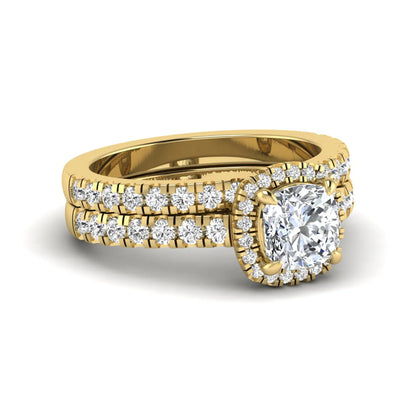 Cushion Halo Bridal Ring Set featuring a 6.00 mm cushion-cut lab grown diamond with a cushion halo, pavé cathedral engagement ring, and matching pavé wedding band in yellow gold