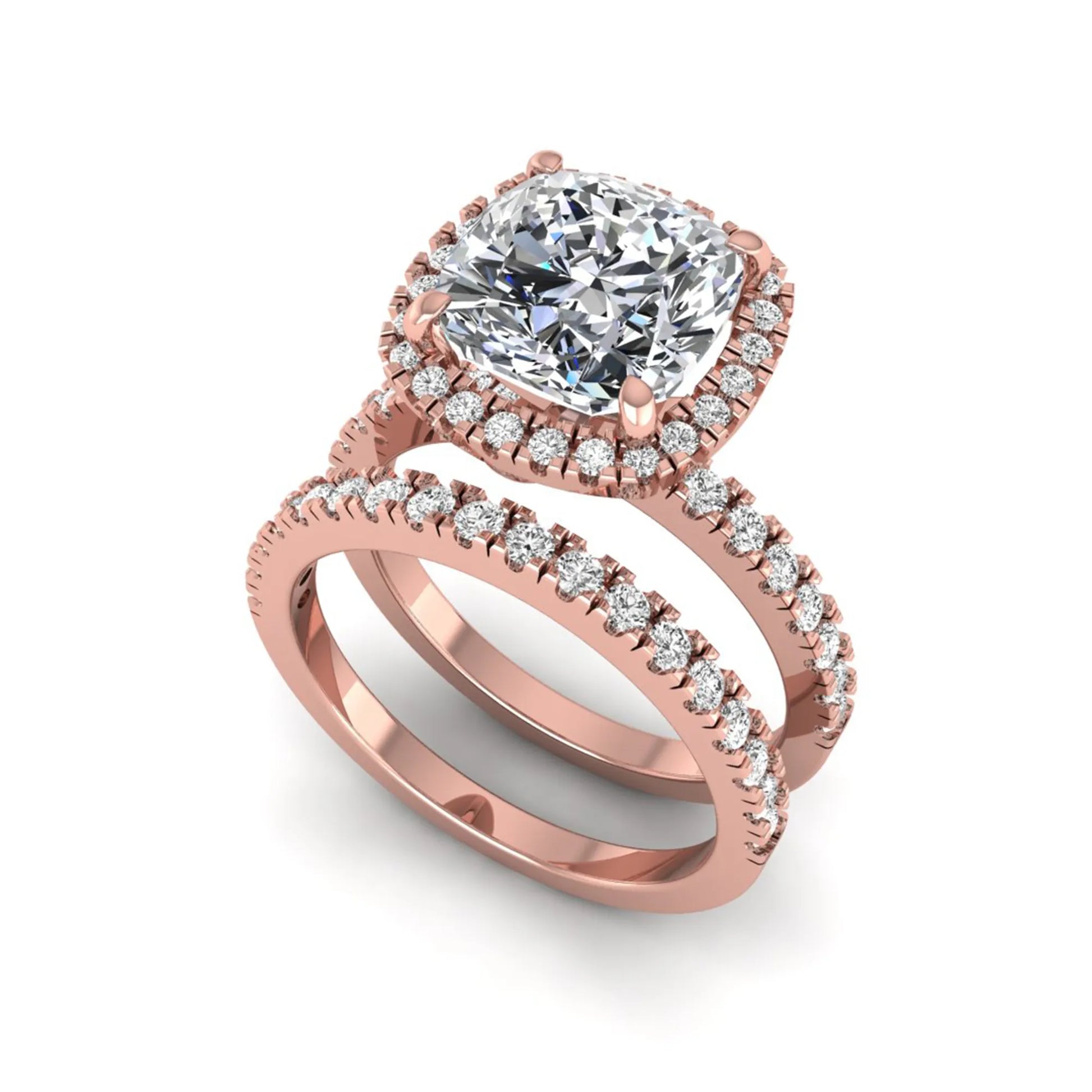 Cushion cut lab grown diamond bridal ring set featuring a halo engagement ring with a matching pavé diamond wedding band in a rose gold style design.