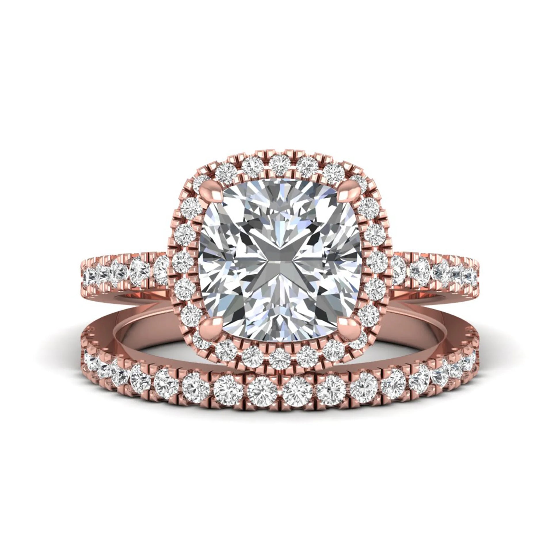 Cushion cut lab grown diamond bridal ring set featuring a halo engagement ring with a matching pavé diamond wedding band in a rose gold style design.