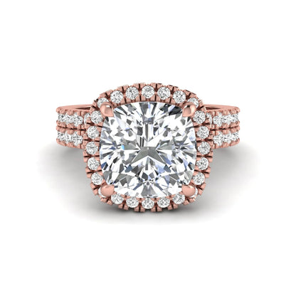 Cushion cut lab grown diamond bridal ring set featuring a halo engagement ring with a matching pavé diamond wedding band in a rose gold style design.