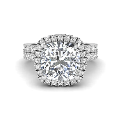 Cushion cut lab grown diamond bridal ring set featuring a halo engagement ring with a matching pavé diamond wedding band in a white gold style design.