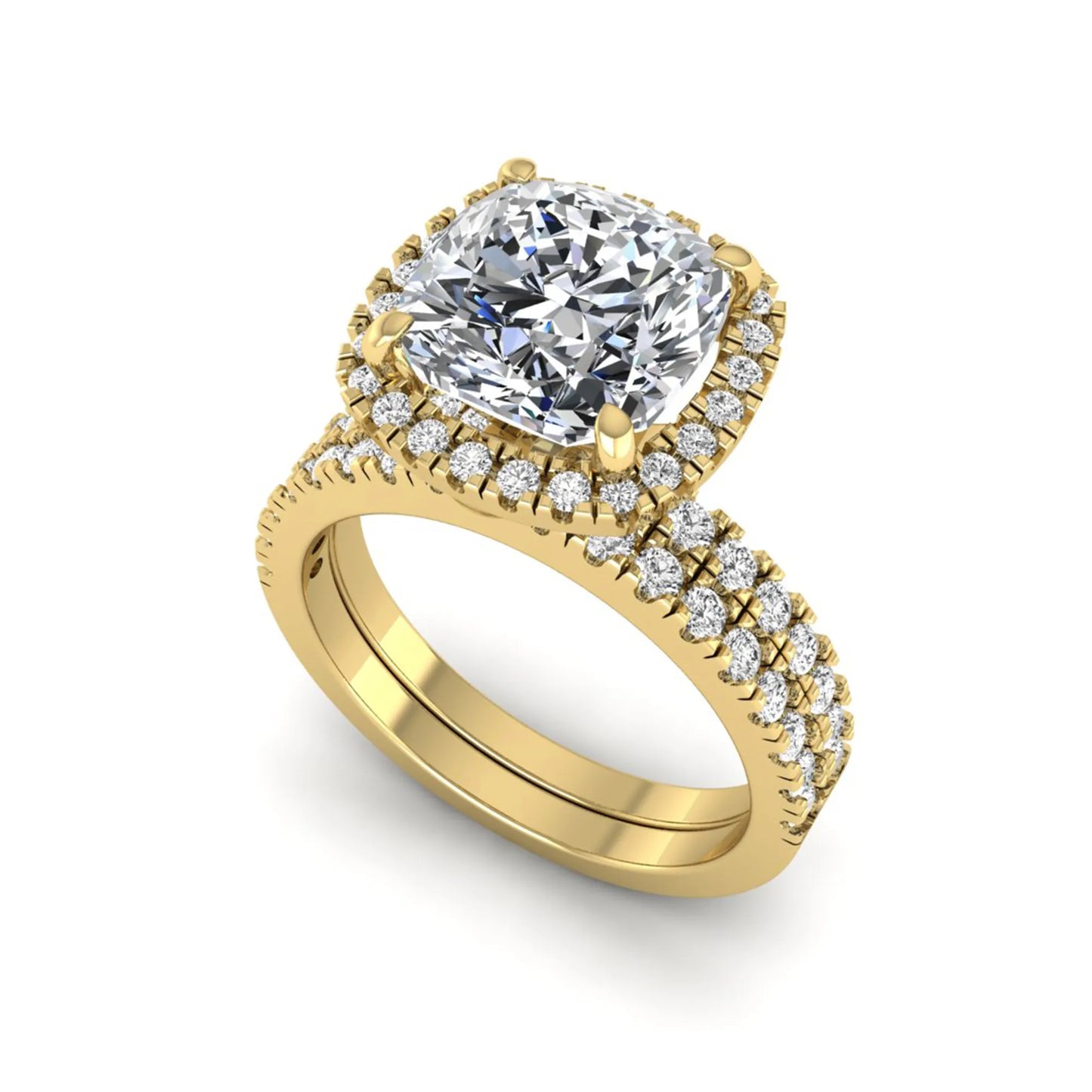 Cushion cut lab grown diamond bridal ring set featuring a halo engagement ring with a matching pavé diamond wedding band in a yellow gold style design.
