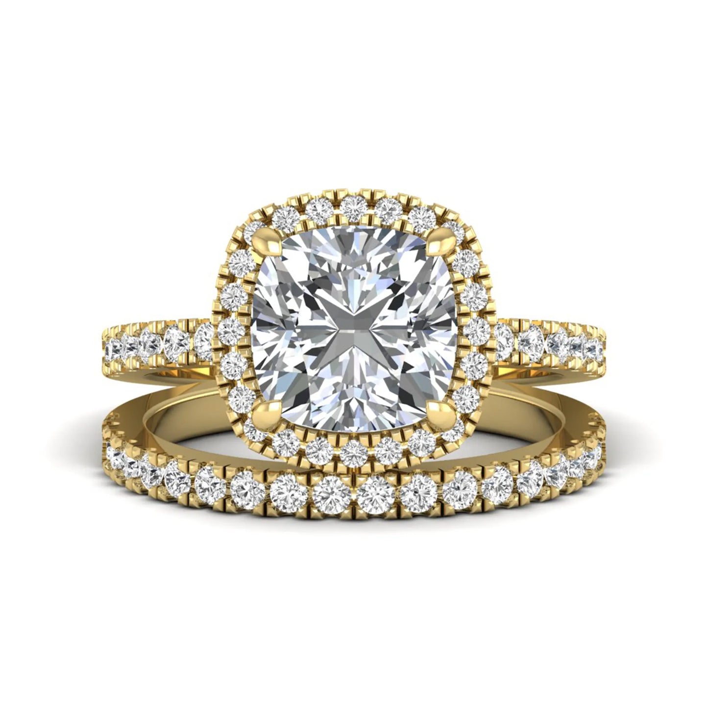 Cushion cut lab grown diamond bridal ring set featuring a halo engagement ring with a matching pavé diamond wedding band in a yellow gold style design.