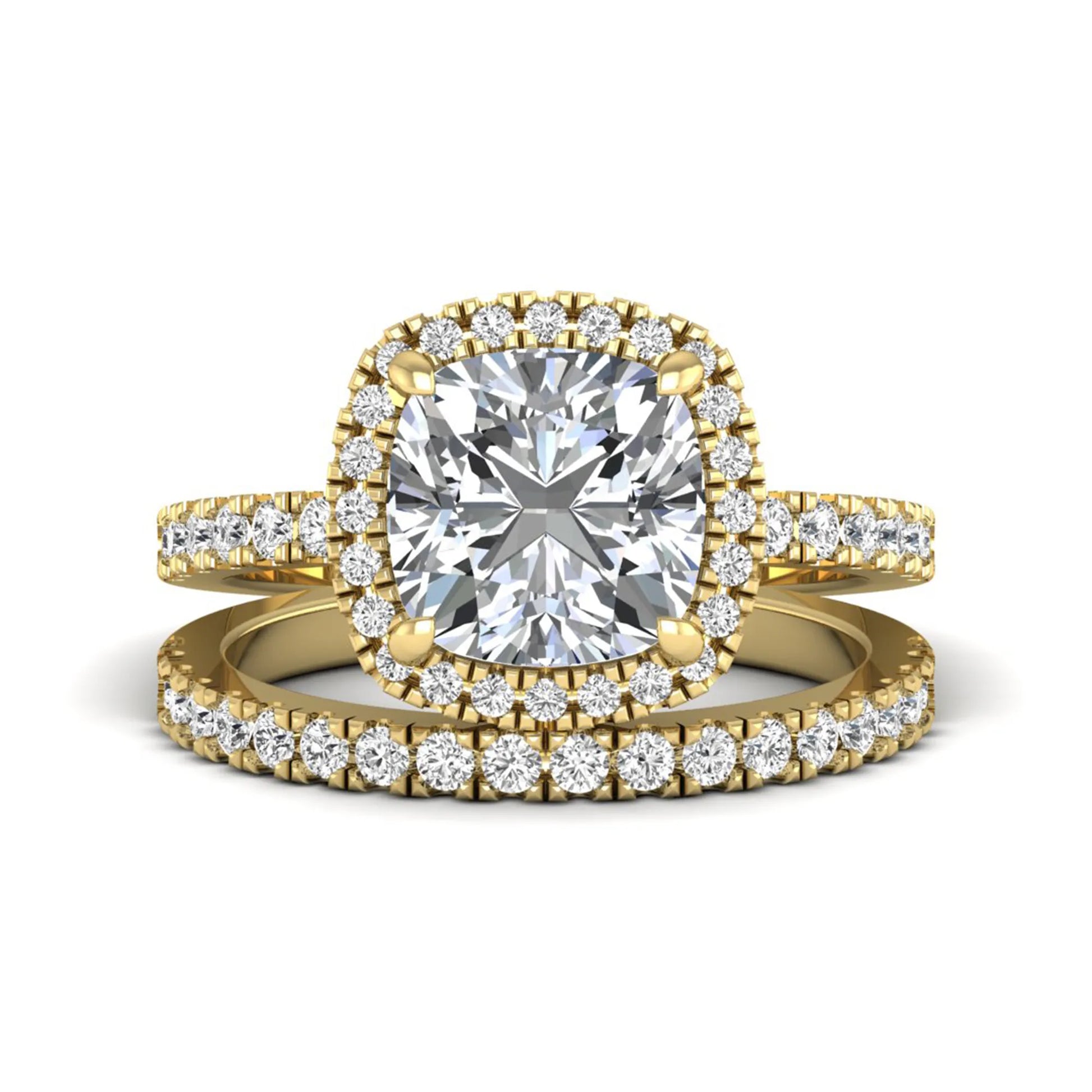 Cushion cut lab grown diamond bridal ring set featuring a halo engagement ring with a matching pavé diamond wedding band in a yellow gold style design.