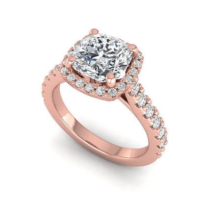 Cushion cut lab grown diamond halo engagement ring featuring a four-prong center diamond, round diamond halo, and pavé diamond band in a rose gold finish.