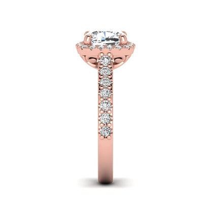Cushion cut lab grown diamond halo engagement ring featuring a four-prong center diamond, round diamond halo, and pavé diamond band in a rose gold finish.