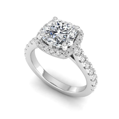Cushion cut lab grown diamond halo engagement ring featuring a four-prong center diamond, round diamond halo, and pavé diamond band in a white gold finish.