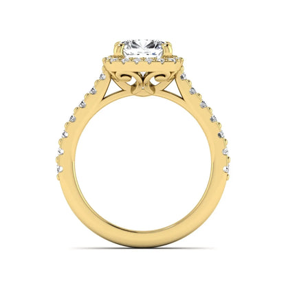 Cushion cut lab grown diamond halo engagement ring featuring a four-prong center diamond, round diamond halo, and pavé diamond band in a yellow gold finish.