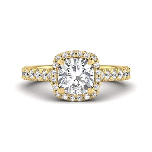 Cushion cut lab grown diamond halo engagement ring featuring a four-prong center diamond, round diamond halo, and pavé diamond band in a yellow gold finish.