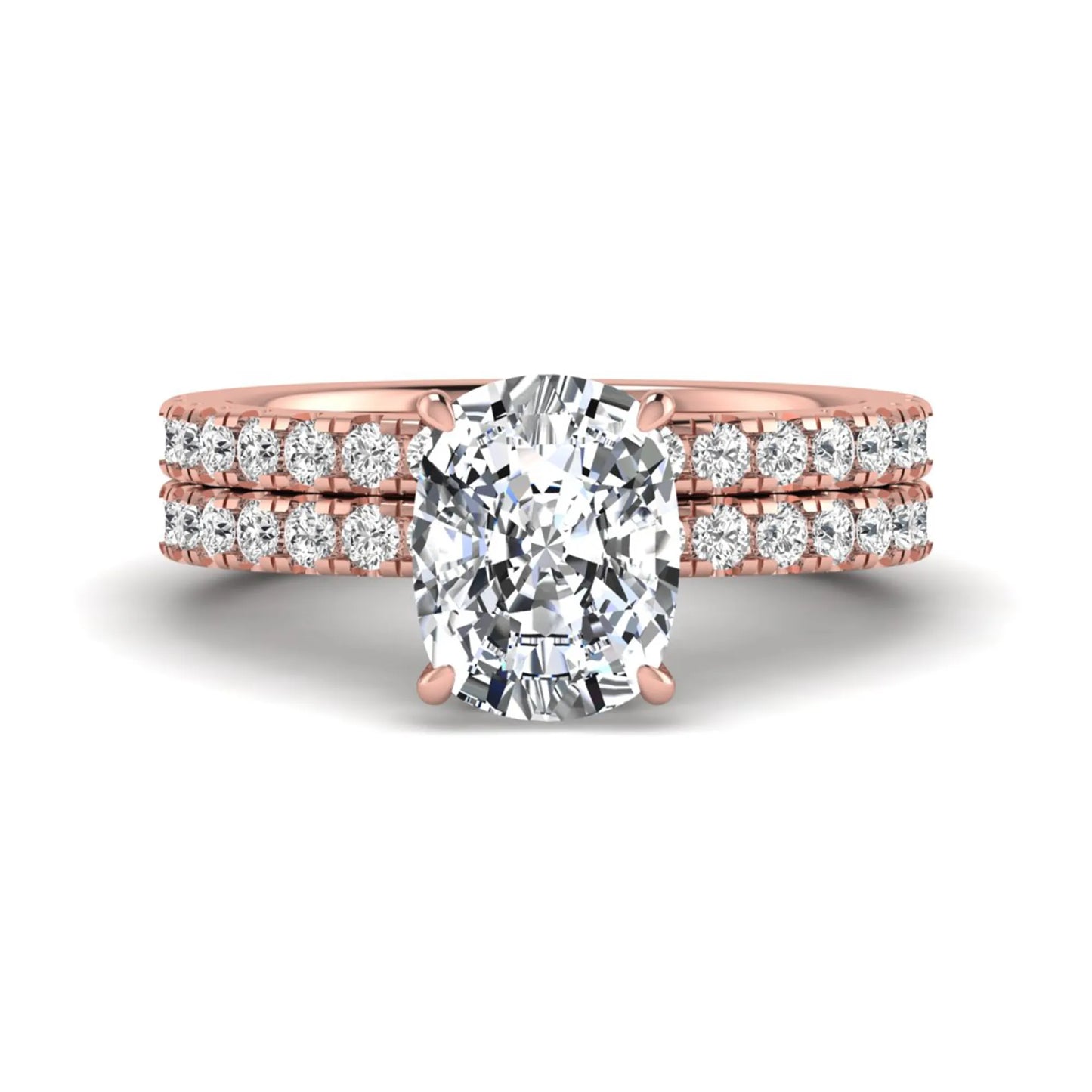 Cushion cut lab grown diamond hidden halo bridal ring set with pavé round diamonds and matching wedding band in a rose gold tone finish.