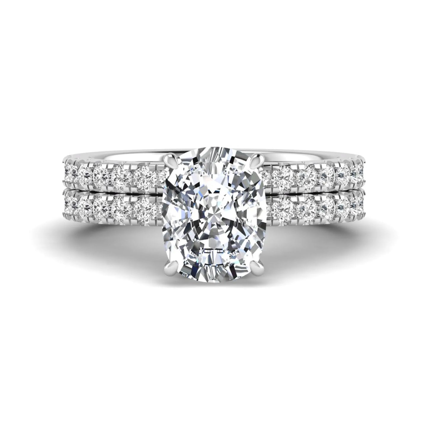 Cushion cut lab grown diamond hidden halo bridal ring set with pavé round diamonds and matching wedding band in a white gold tone finish.
