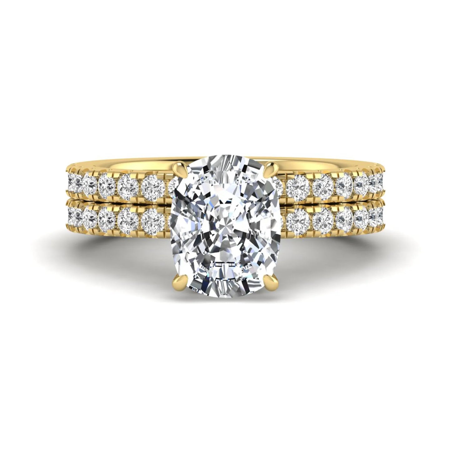 Cushion cut lab grown diamond hidden halo bridal ring set with pavé round diamonds and matching wedding band in a yellow gold tone finish.