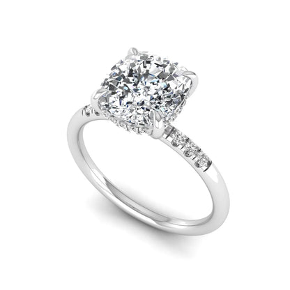 Cushion hidden halo lab grown diamond engagement ring featuring a 2.35 carat cushion cut center diamond with round accent diamonds on a white gold band.