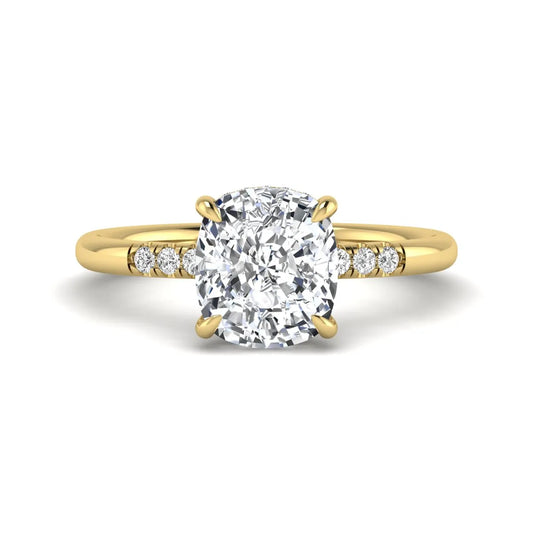 Cushion hidden halo lab grown diamond engagement ring featuring a 2.35 carat cushion cut center diamond with round accent diamonds on a yellow gold band.