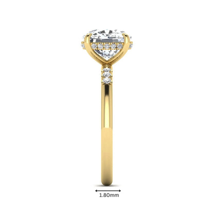 Cushion hidden halo lab grown diamond engagement ring featuring a 2.35 carat cushion cut center diamond with round accent diamonds on a yellow gold band.