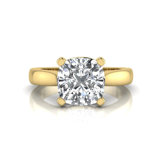 IGI certified 2.04 carat cushion cut lab grown diamond solitaire engagement ring in a classic four-prong yellow gold setting.