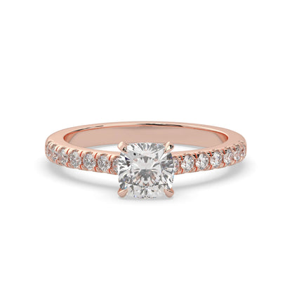 Cushion cut lab grown diamond prong set engagement ring with pavé band and rose gold metal tone design