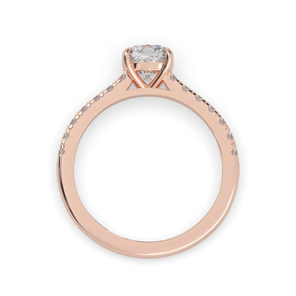 Cushion cut lab grown diamond prong set engagement ring with pavé band and rose gold metal tone design