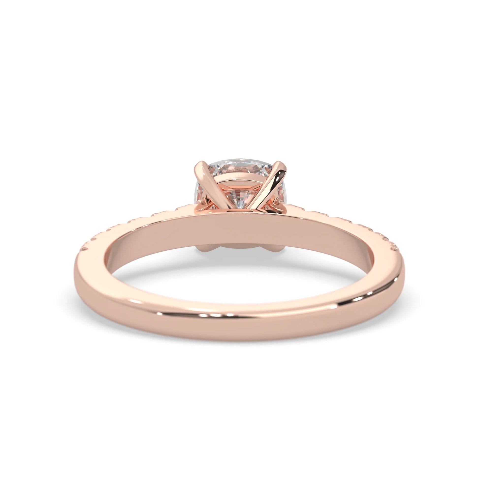 Cushion cut lab grown diamond prong set engagement ring with pavé band and rose gold metal tone design