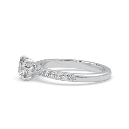 Cushion cut lab grown diamond prong set engagement ring with pavé band and white gold metal tone design