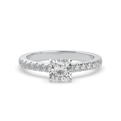 Cushion cut lab grown diamond prong set engagement ring with pavé band and white gold metal tone design