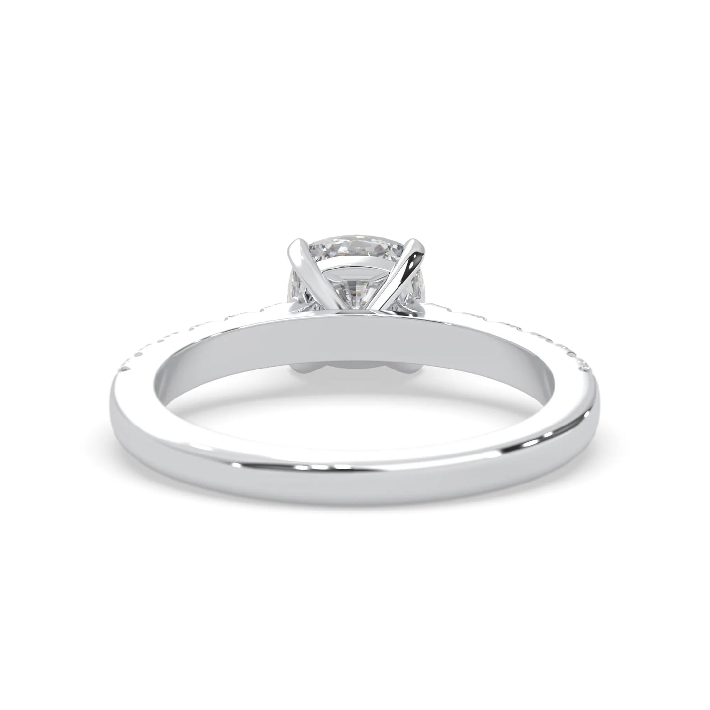 Cushion cut lab grown diamond prong set engagement ring with pavé band and white gold metal tone design