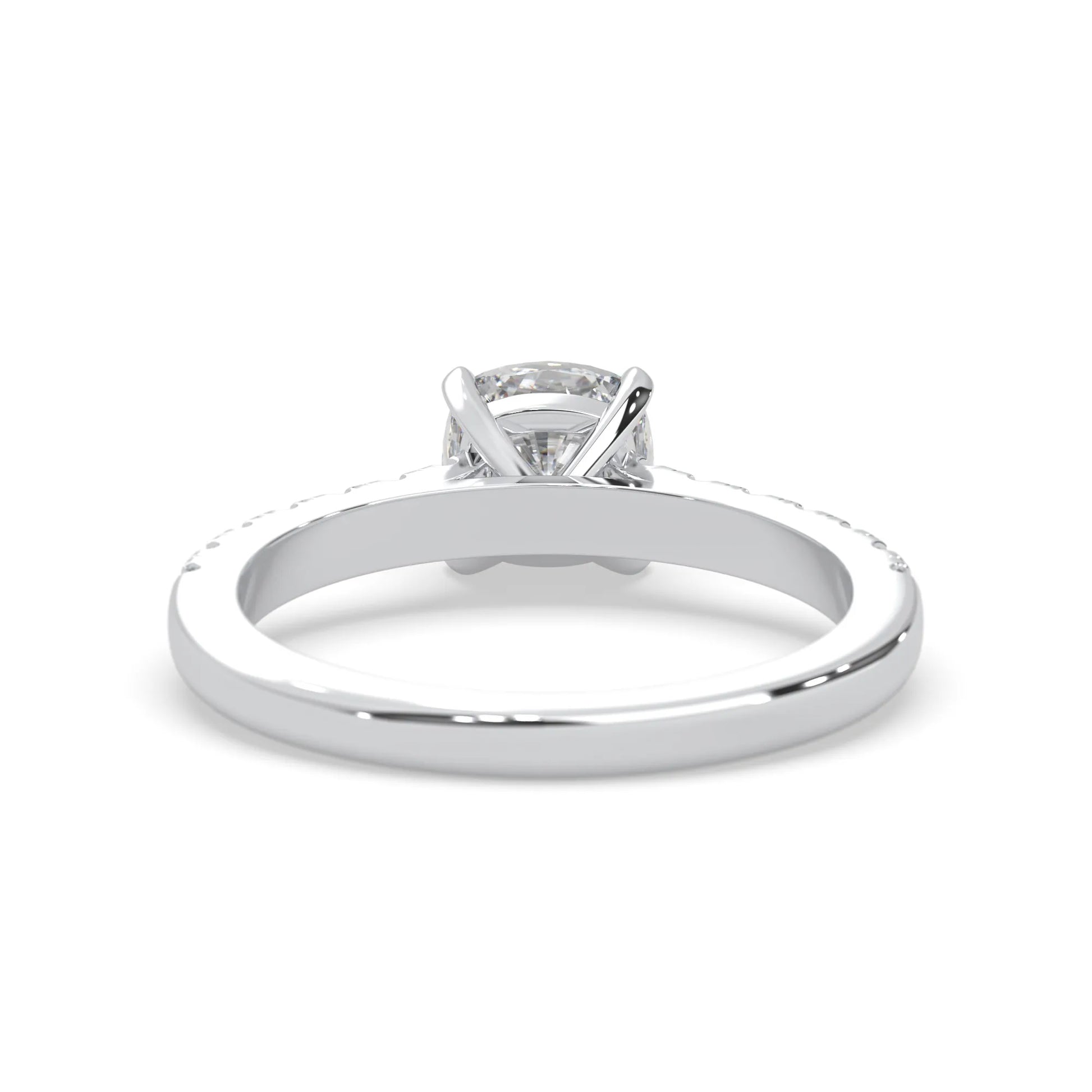 Cushion cut lab grown diamond prong set engagement ring with pavé band and white gold metal tone design