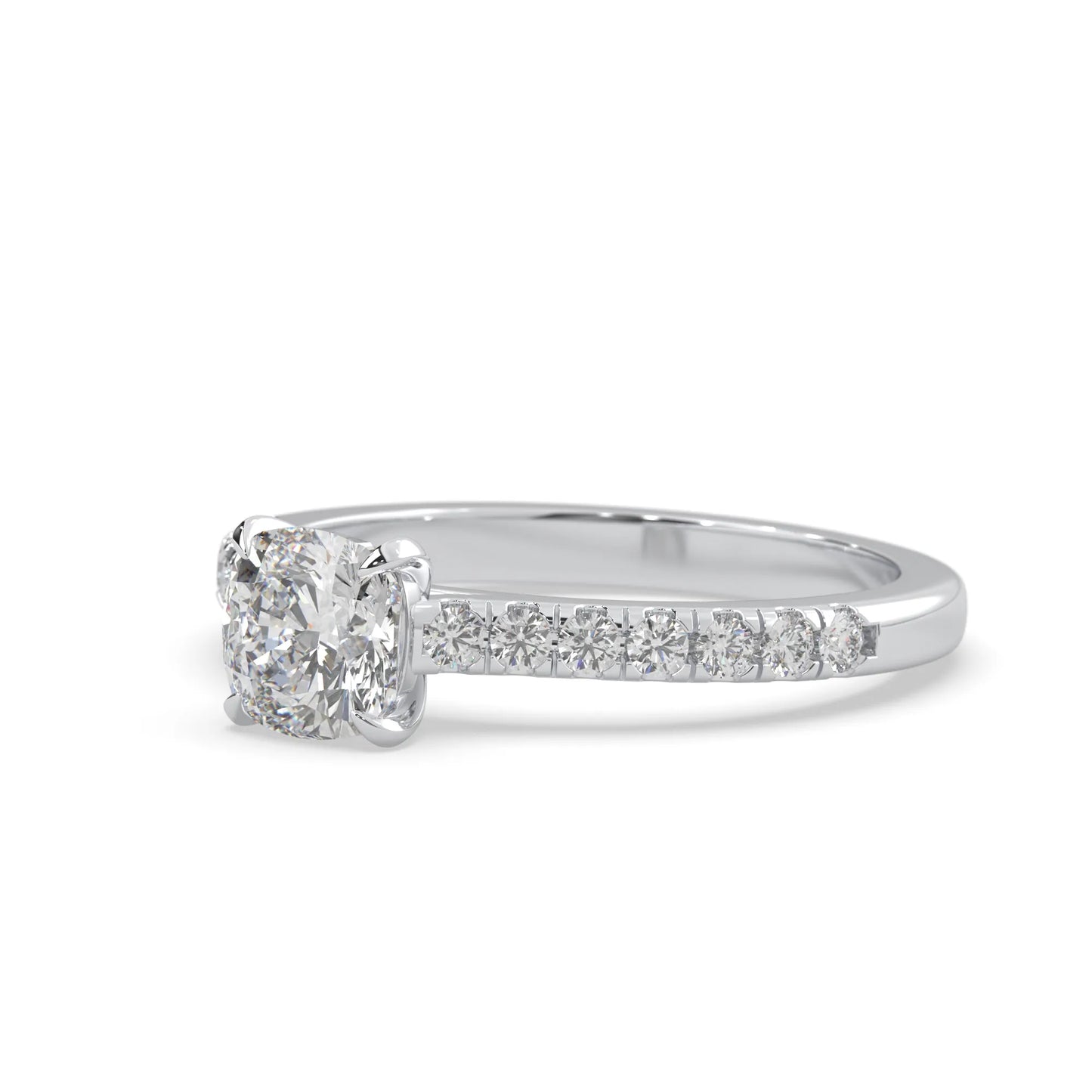 Cushion cut lab grown diamond prong set engagement ring with pavé band and white gold metal tone design