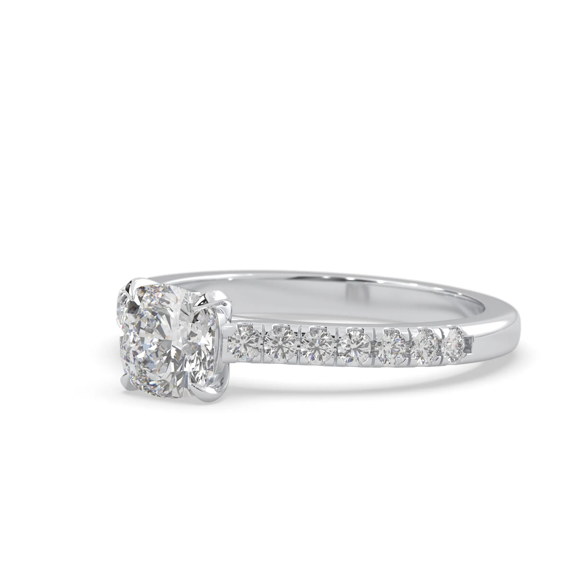 Cushion cut lab grown diamond prong set engagement ring with pavé band and white gold metal tone design