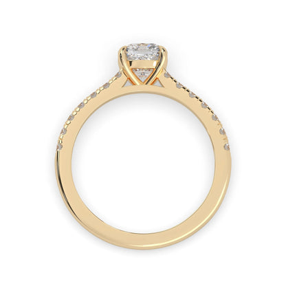 Cushion cut lab grown diamond prong set engagement ring with pavé band and yellow gold metal tone design