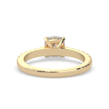 Cushion cut lab grown diamond prong set engagement ring with pavé band and yellow gold metal tone design